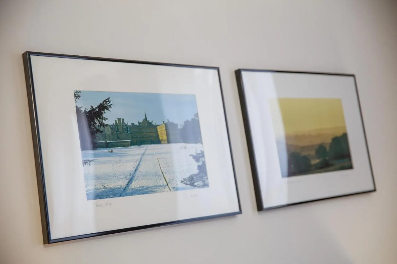 three framed pictures on a wall at The Buttery in Oxford